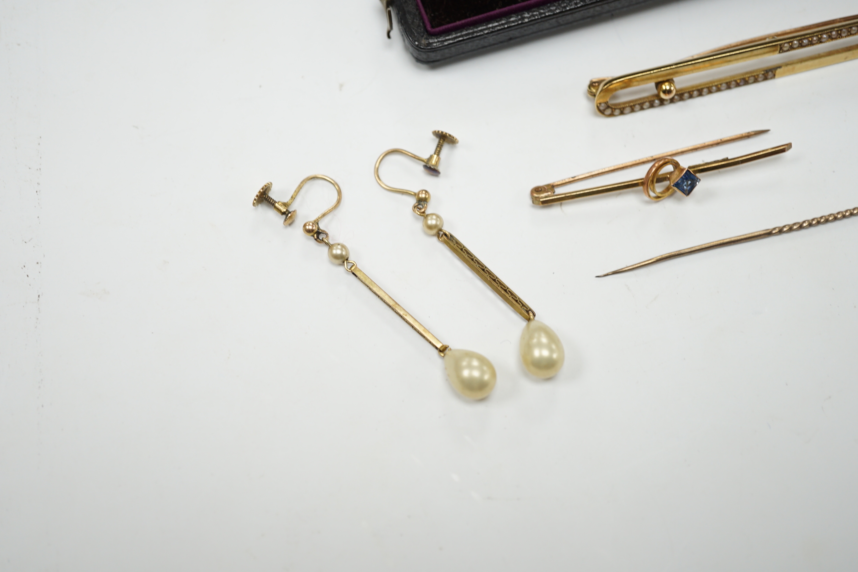 An Edwardian 15ct and seed pearl set bar brooch, 64mm, gross 4.9 grams, a 9ct bar brooch, two stick pins and a pair of 9ct and simulated pearl set drop earrings.